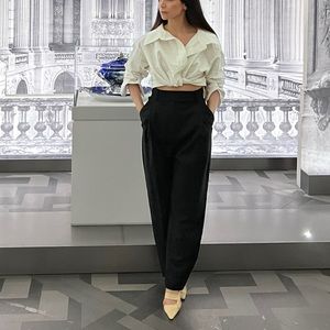 ALEXANDER WANG
Twist-front cropped cotton-blend poplin shirt